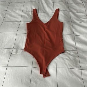 Orange bodysuit from A&F. Size small